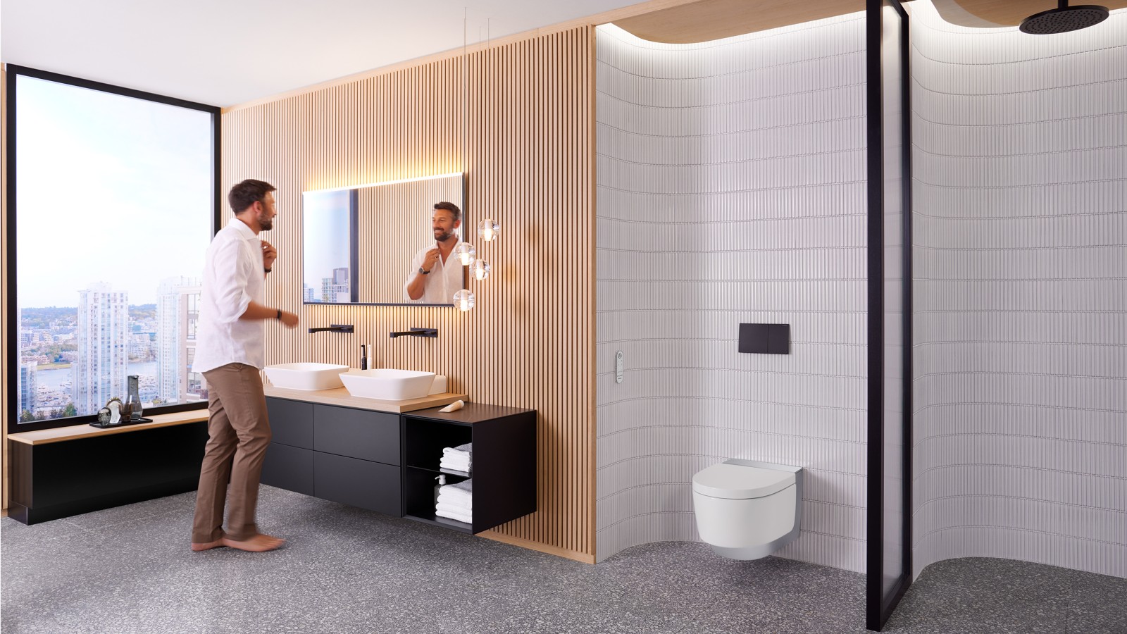 Hombre en el baño frente al espejo Geberit Option Plus Square y el mueble de baño negro Geberit ONE (© Geberit) Hombre en el baño frente al espejo Geberit Option Plus Square y el mueble de baño negro Geberit ONE (© Geberit)
