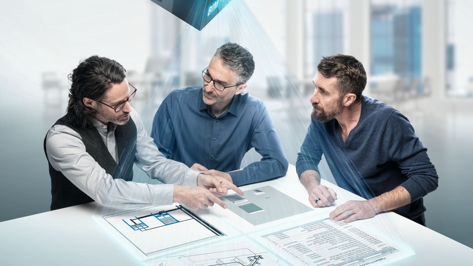 Los planificadores discuten en torno a una mesa con el símbolo BIM